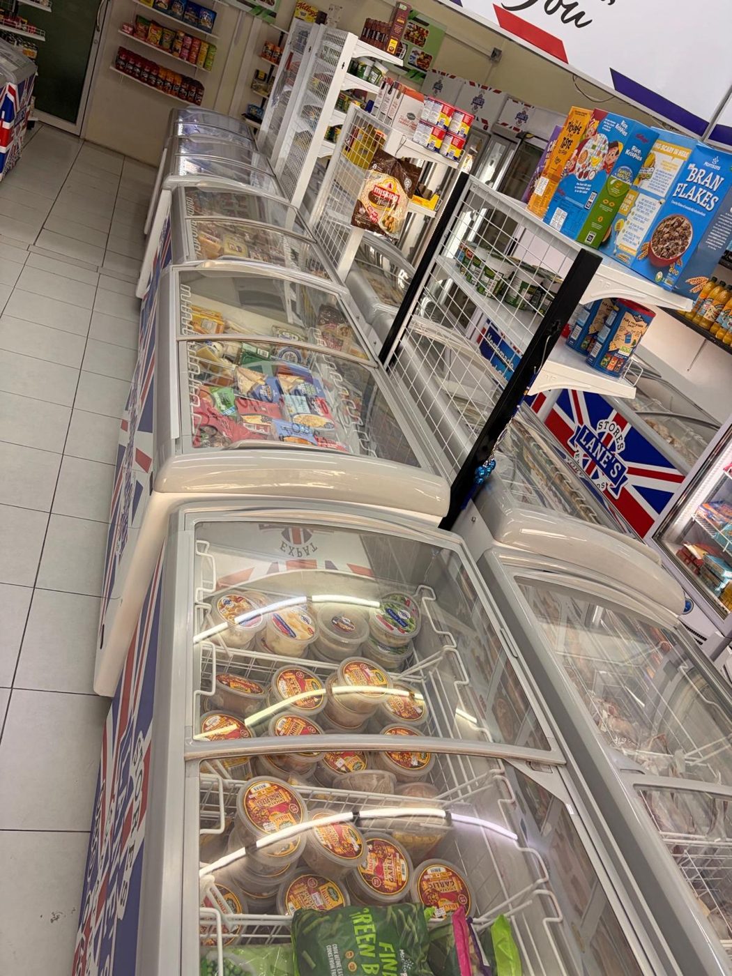 Chest freezers stocked with frozen British foods in our Darkside shop