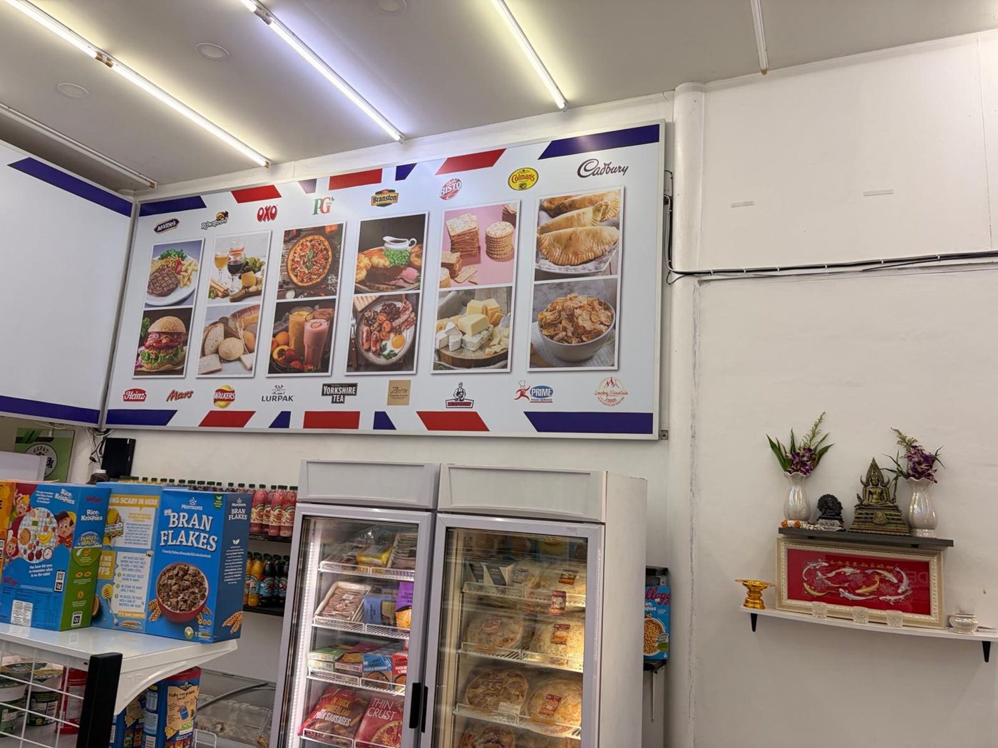 British ready meals and pies menu display above the chilled fridges
