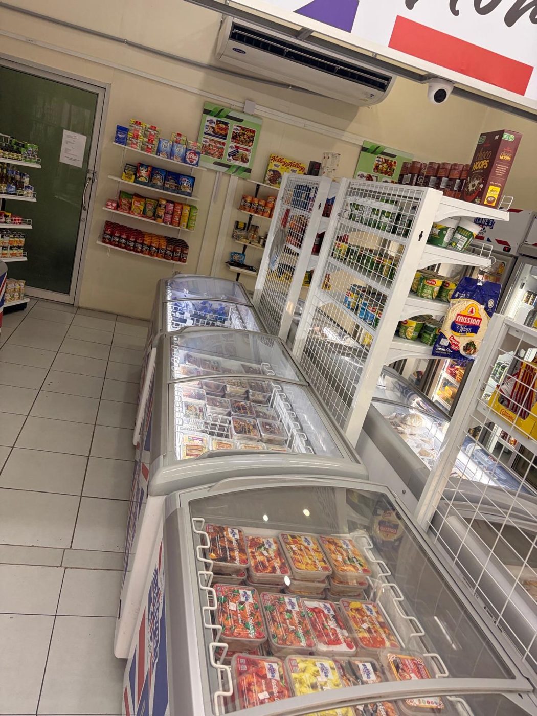 Aisle of freezers and shelves stocking UK foods in Pattaya