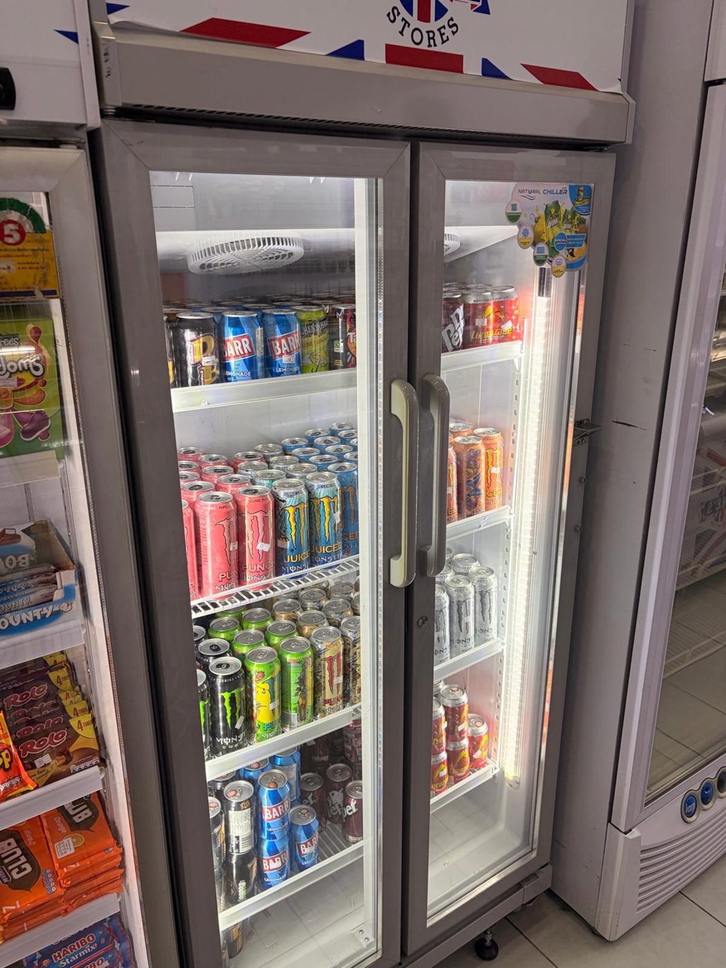Chilled drinks fridge with British soft drinks and cans